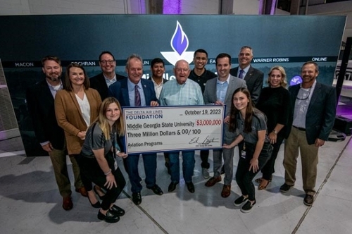 Delta Air Lines presents awards Middle Georgia State university with their grant check for $3 million at Dinner in the Hangar. 